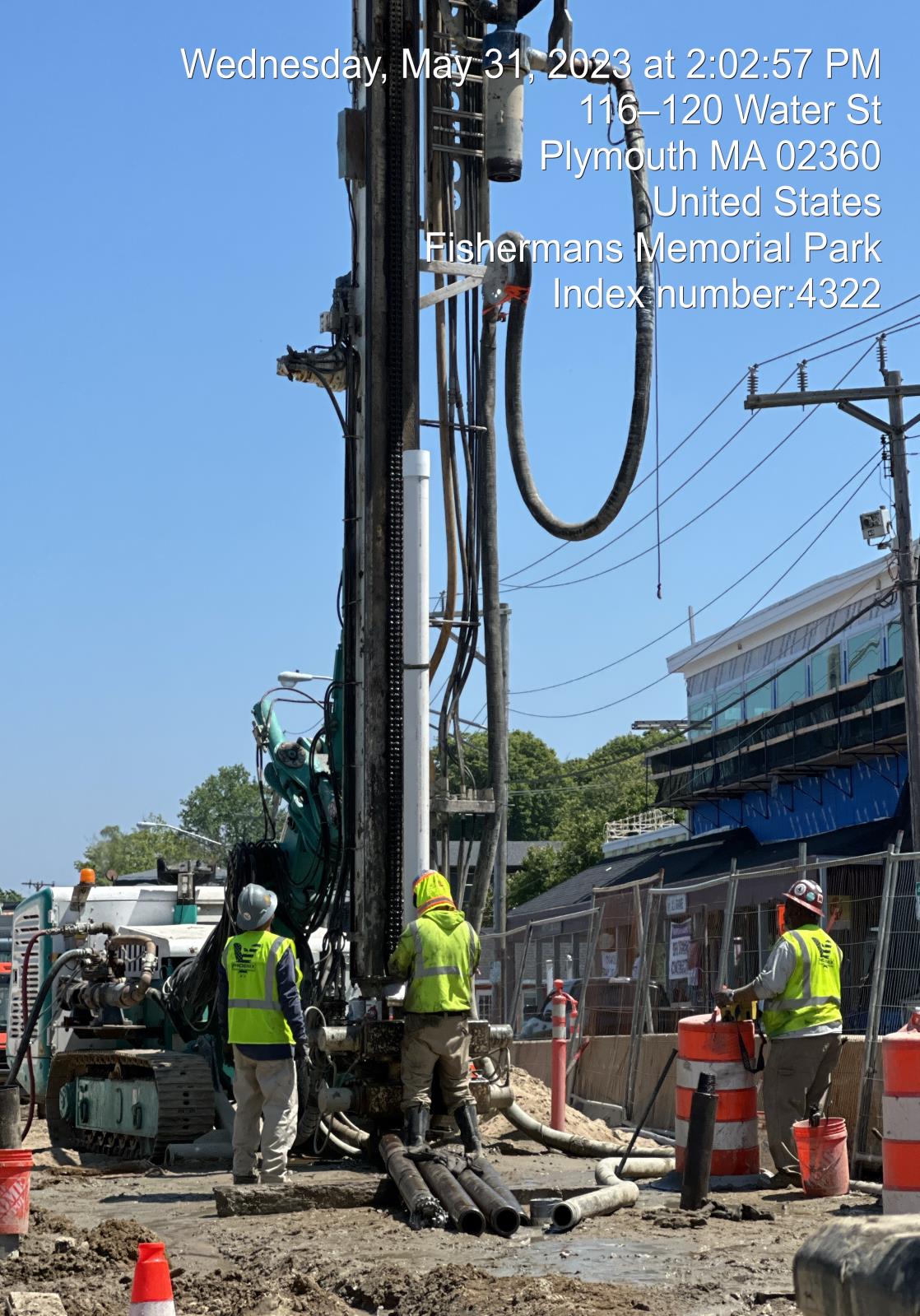 crew drilling borehole for well on Water Street
