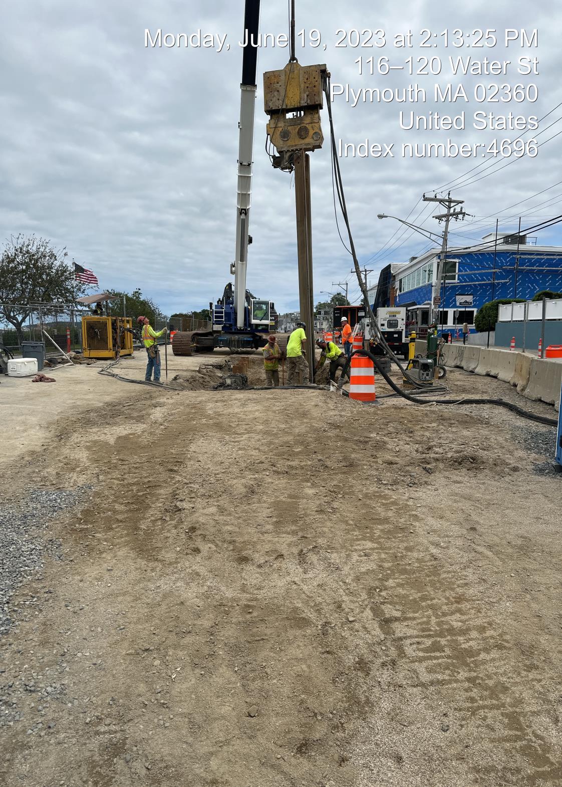 contractor removing sheeting from ground