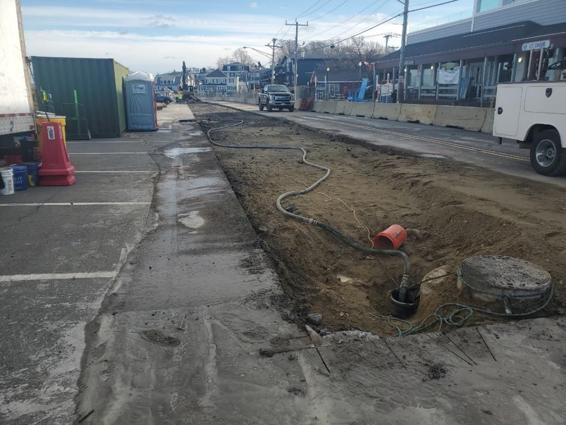 Saw cut and pavement removal within sewer trench