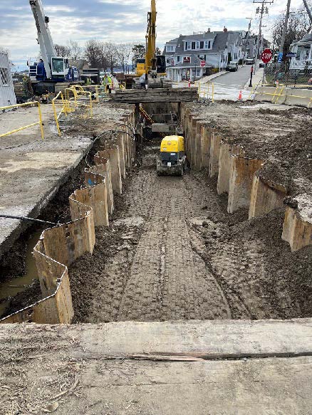trench backfilling and material compaction along the sewer interceptor on Water Street