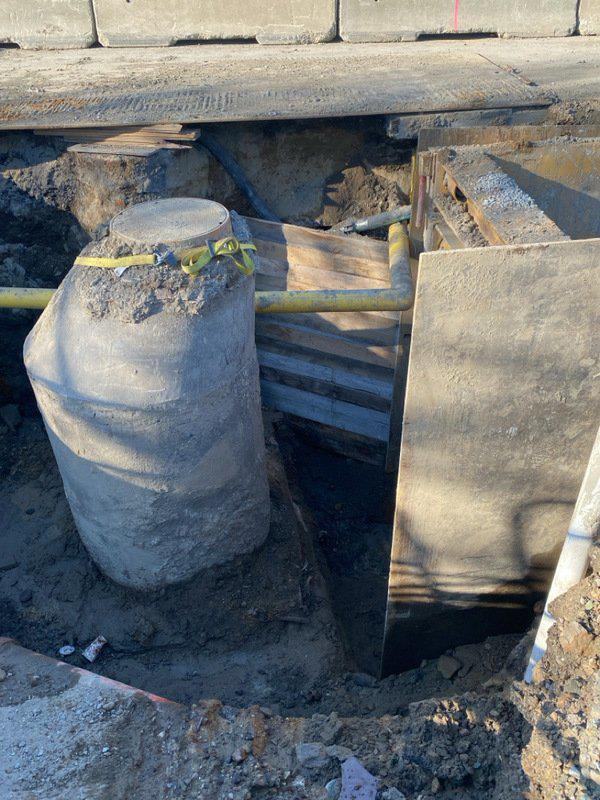 installation of timber trench shoring around existing sewer manhole