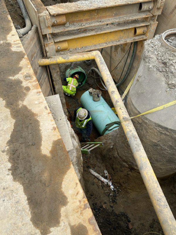 connection of 30-inch PVC gravity sewer to existing sewer manhole