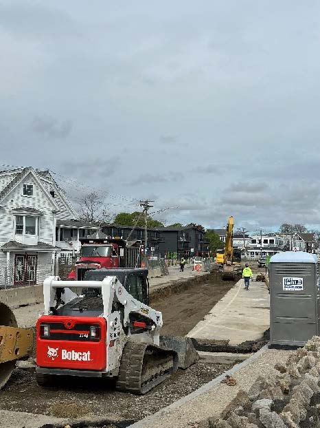 trench backfilling and material compaction along Water Street